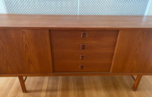 Draweres on Gorgeous Scandinavian design teak credenza. Four drawers with square insert pulls and two sliding cabinets with shelves- Cook Street Vintage