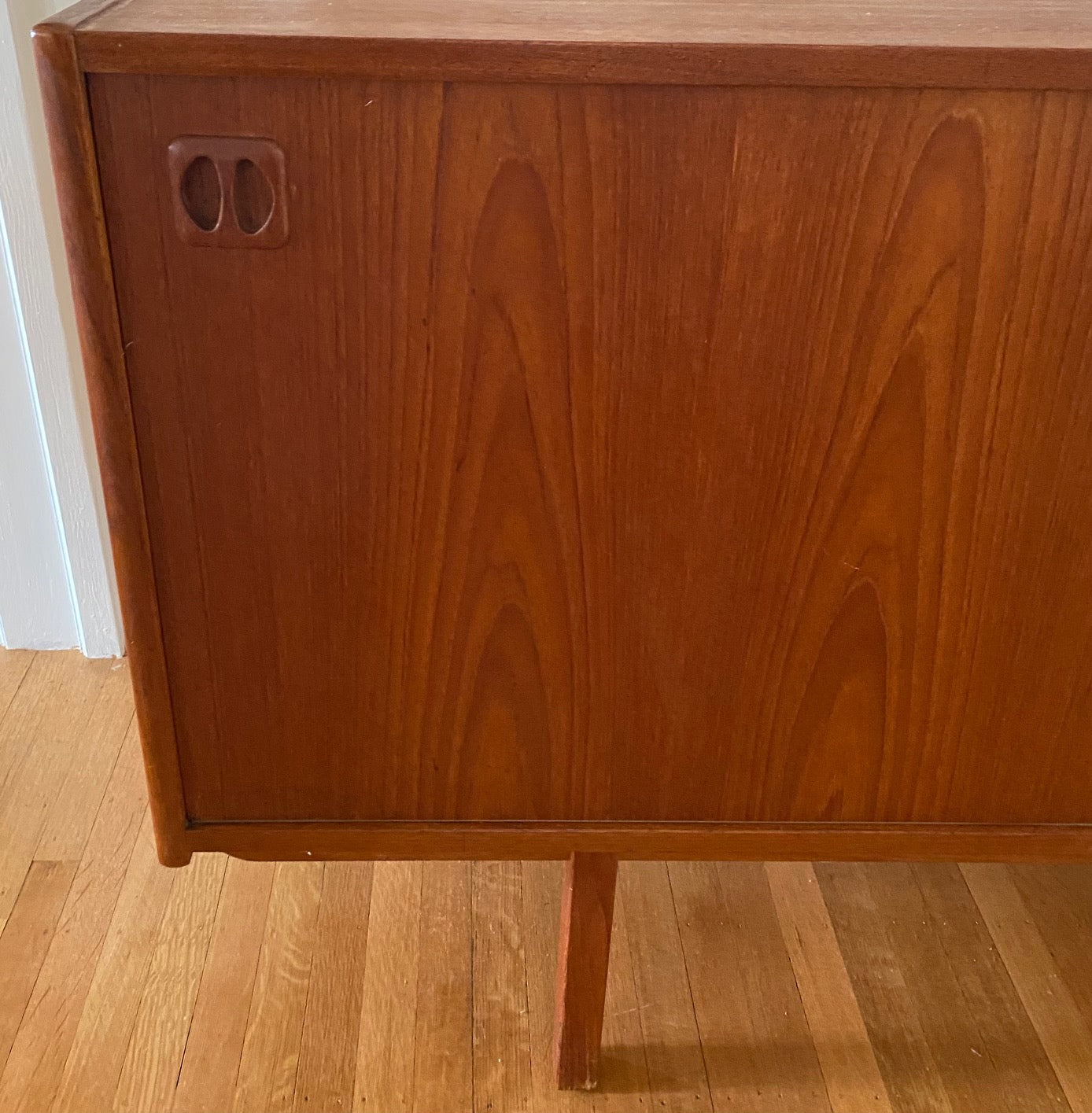 Gorgeous Scandinavian design teak credenza. Four drawers with square insert pulls and two sliding cabinets with shelves- Cook Street Vintage