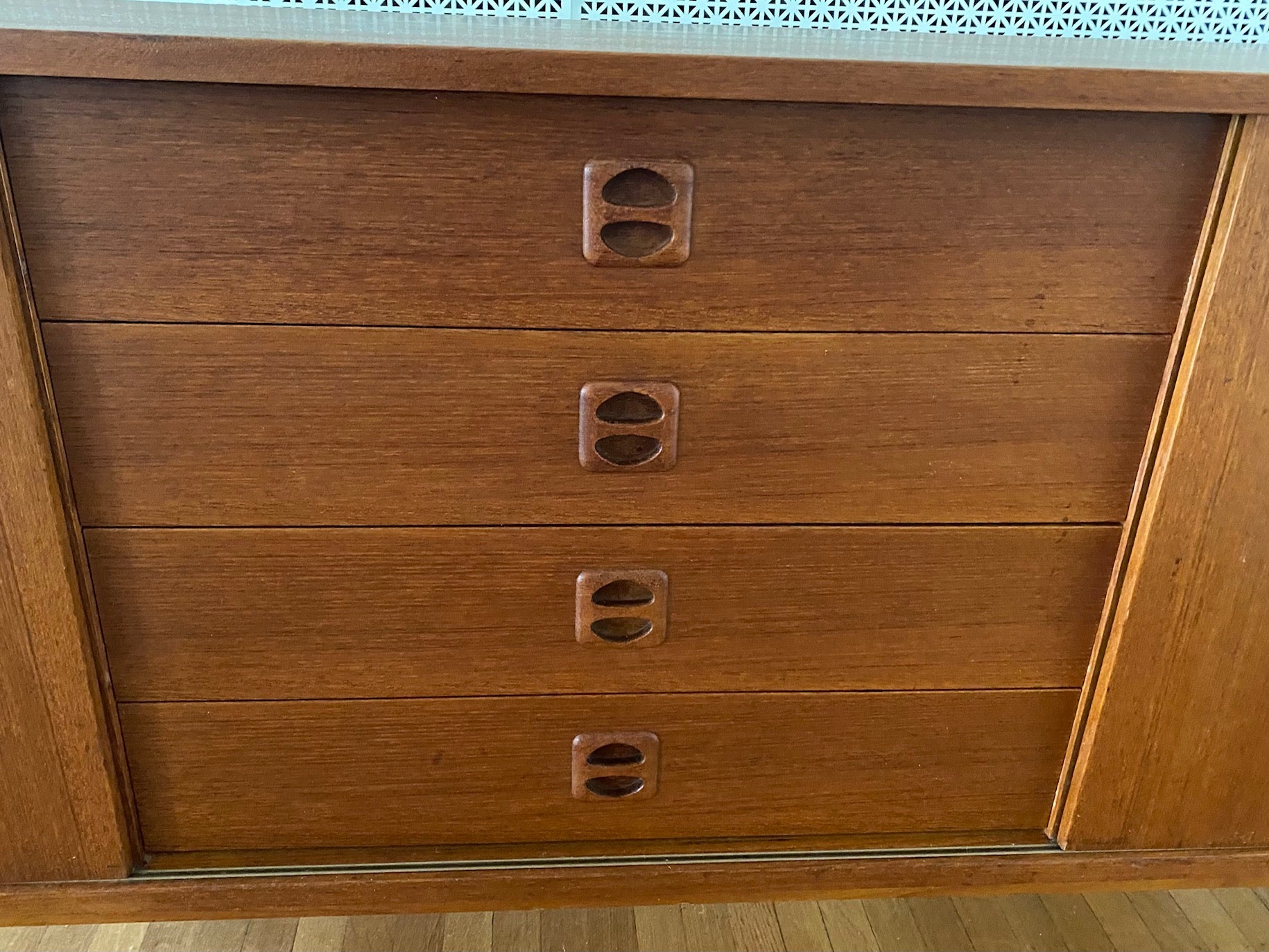 Gorgeous Scandinavian design teak credenza. Four drawers with square insert pulls and two sliding cabinets with shelves-Cook Street Vintage