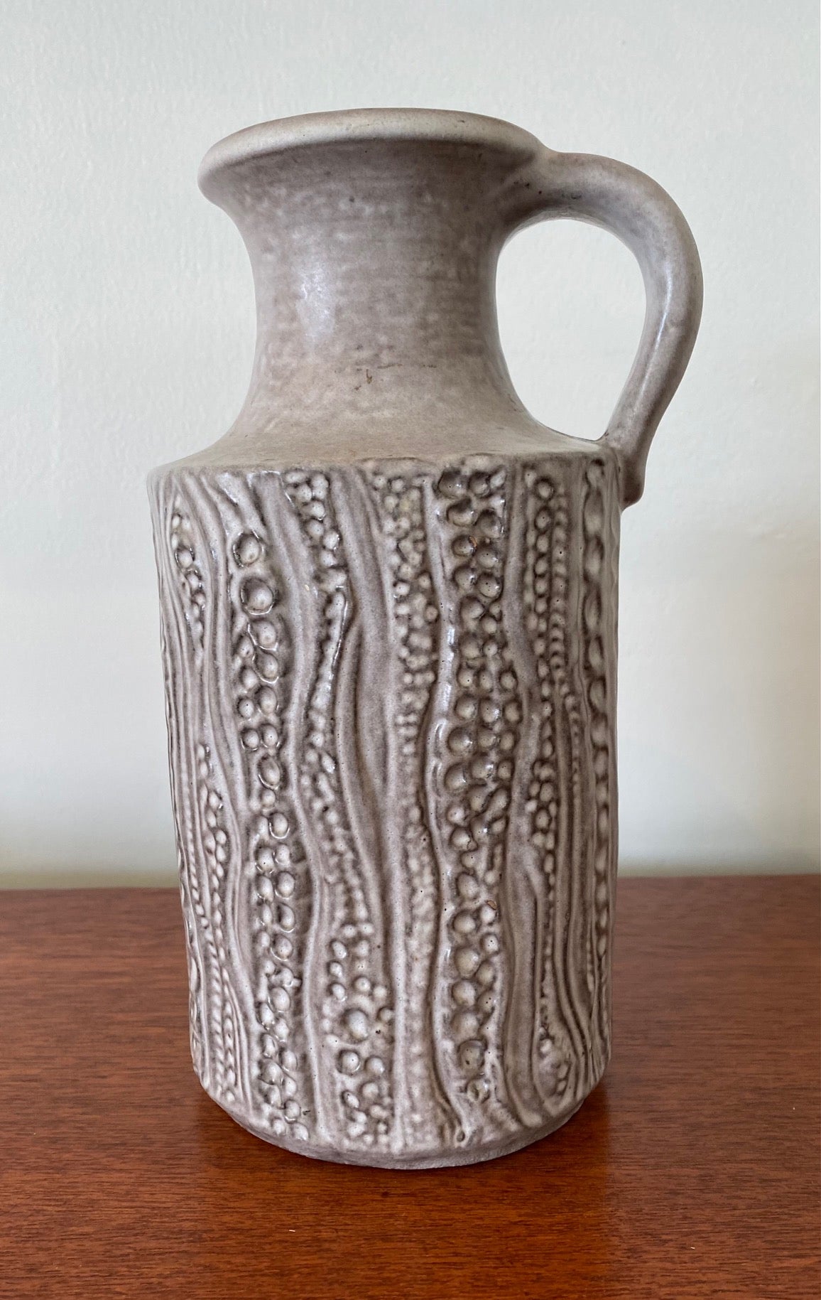 Beautiful West German handled vase with milky white matt glaze.  Gorgeous organic dimpled textured pattern. Marked 1853-25 West Germany on base Cook Street Vintage
