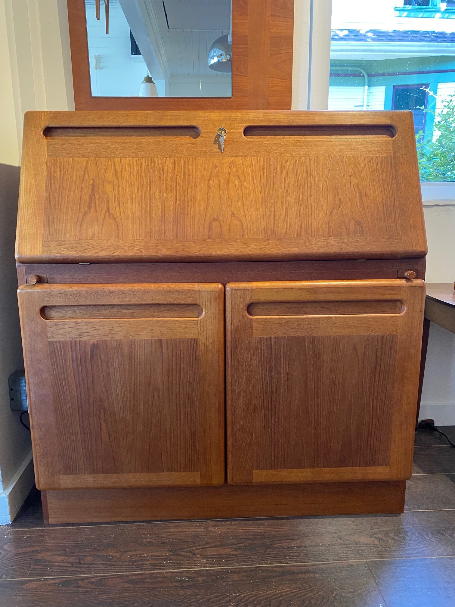 Danish midcentury teak desk for home office with carved handled lower cabinets- Cook Street Vintage