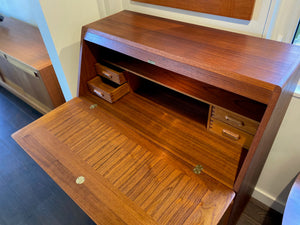 Birds eye view of wood grain and drawers inside MCM Danish secretary teak desk- Cook Street Vintage