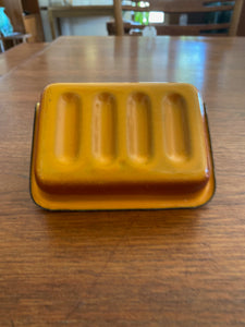 Bottom of vintage orange and grey metal soap dish - Cook Street Vintage