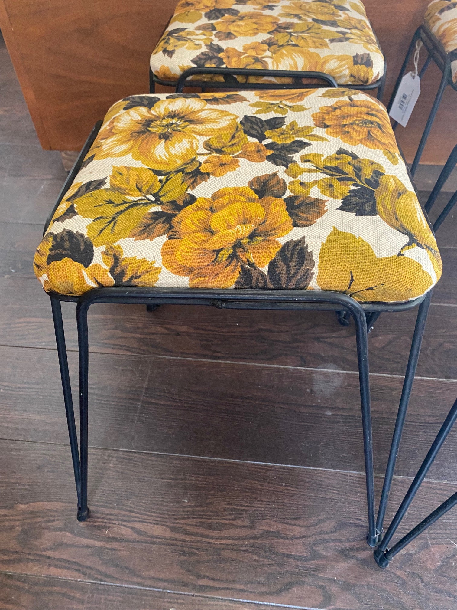 CLose up of vintage stacking stool with yellow floral upholstery- Cook Street Vintage