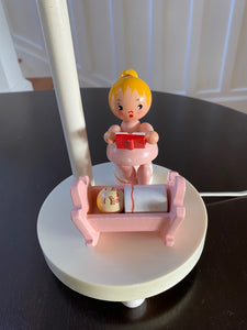 Mother sitting beside baby in pink cradle of Irmi nursery lamp- Cook Street Vintage
