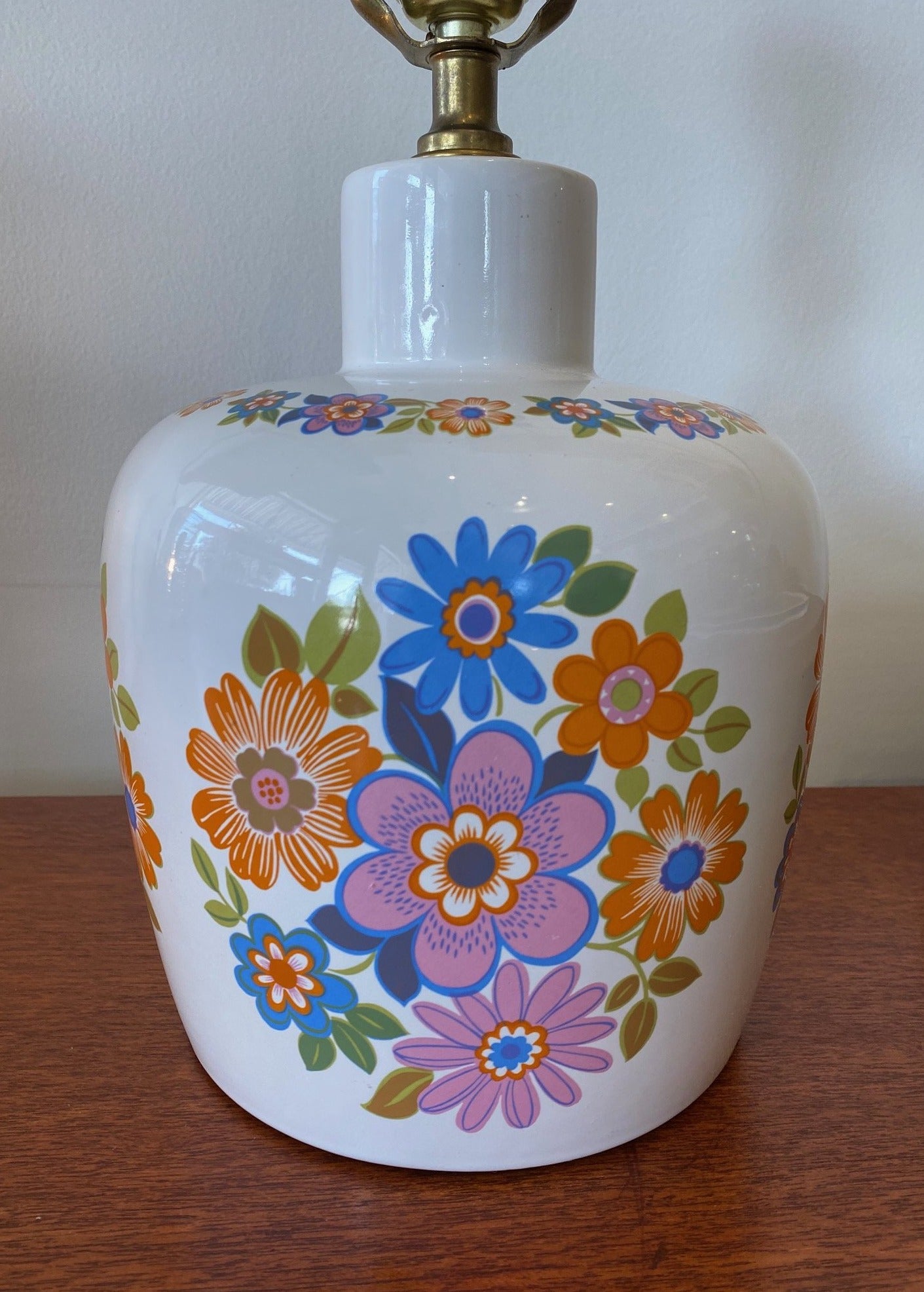 Close up of orange, pink and blue flowers on mid century ceramic bedroom lamp- Cook Street Vintage
