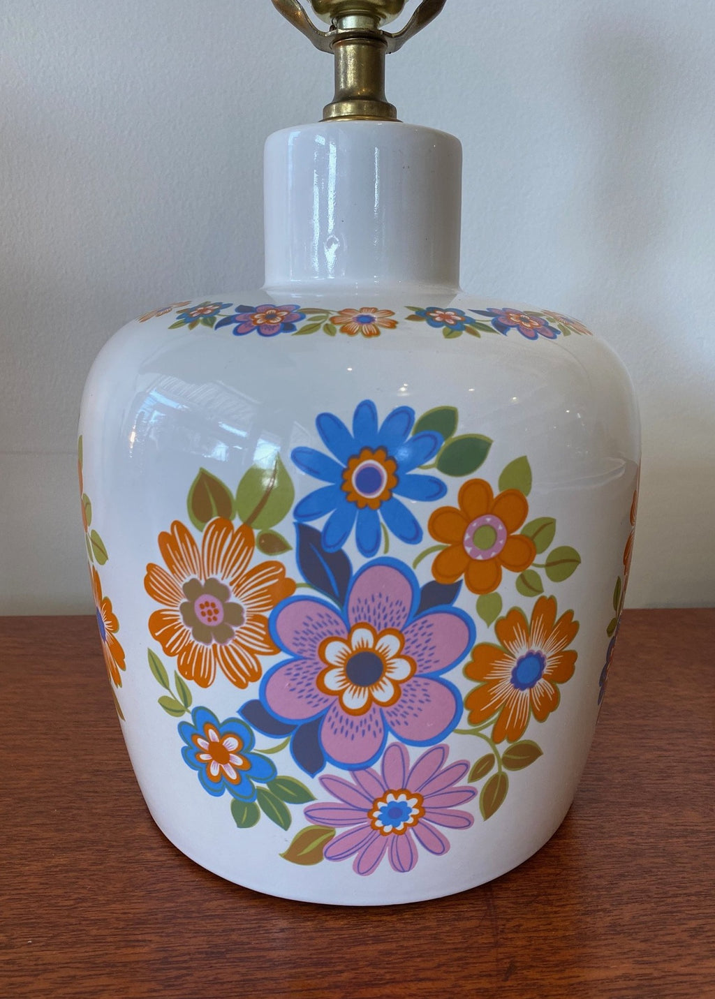 Close up of orange, pink and blue flowers on mid century ceramic bedroom lamp- Cook Street Vintage