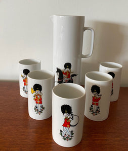 Rare MCM Thomas Rosenthal tall ceramic pitcher with 5 matching cups. Gorgeous military Royal Guard soldier theme with musical instruments. In beautiful vintage condition. No cracks or chips-Cook Street Vintage