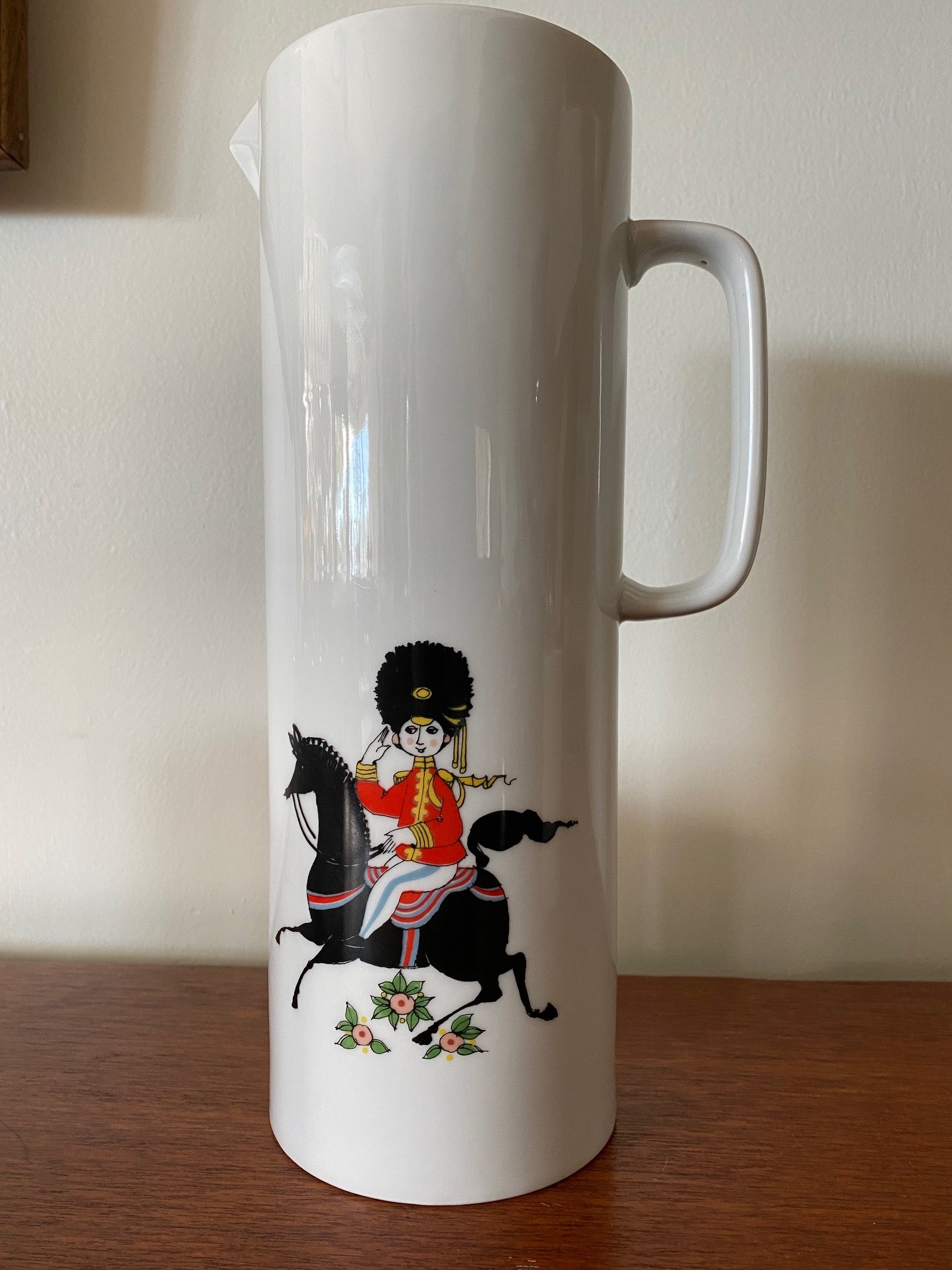 Rare MCM Thomas Rosenthal tall ceramic pitcher with 5 matching cups. Gorgeous military Royal Guard soldier theme with musical instruments. In beautiful vintage condition. No cracks or chips-Cook Street Vintage