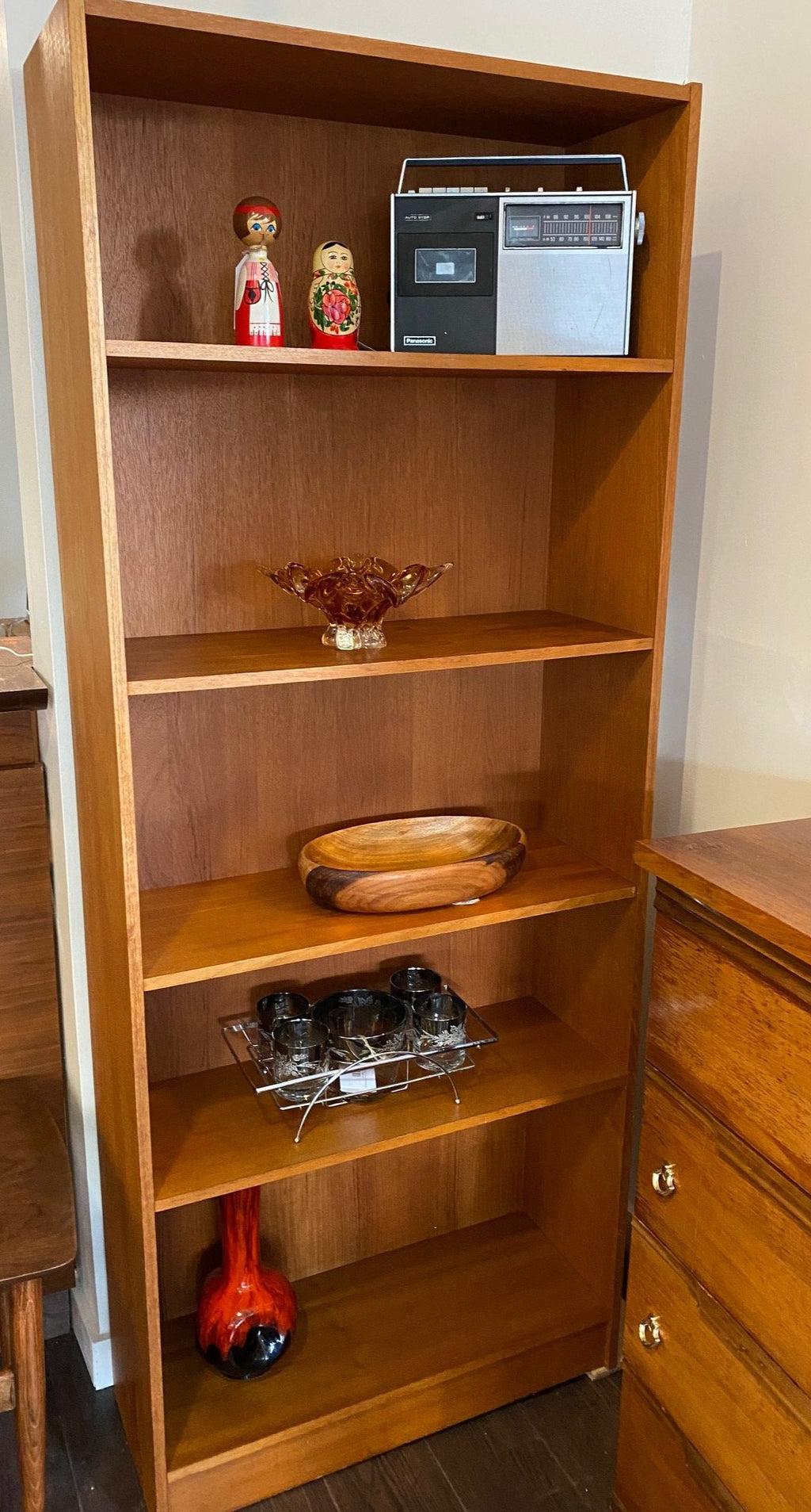 MCM teak shelves and bookcase with Russian nesting dolls and traditional wooden Finnish doll Cook Street Vintage