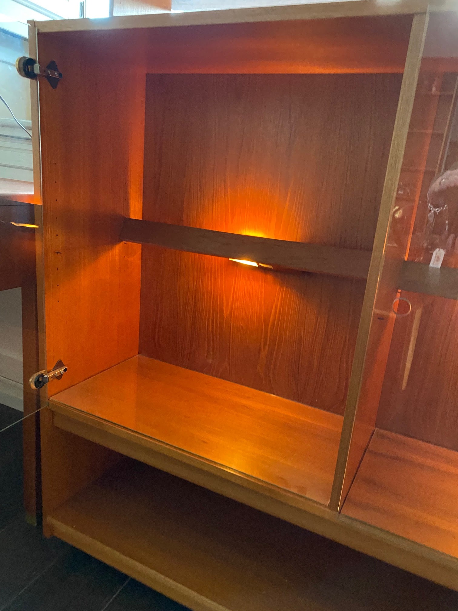 Left side of Danish teak cabinet with large lower shelf- Cook Street Vintage
