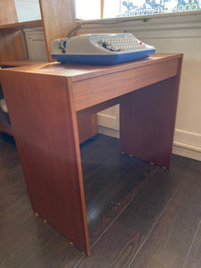 Sweet small teak desk with handy drawer. Would also make a handy entry table. Shown here with our portable Underwood typewriter- Cook Street Vintage