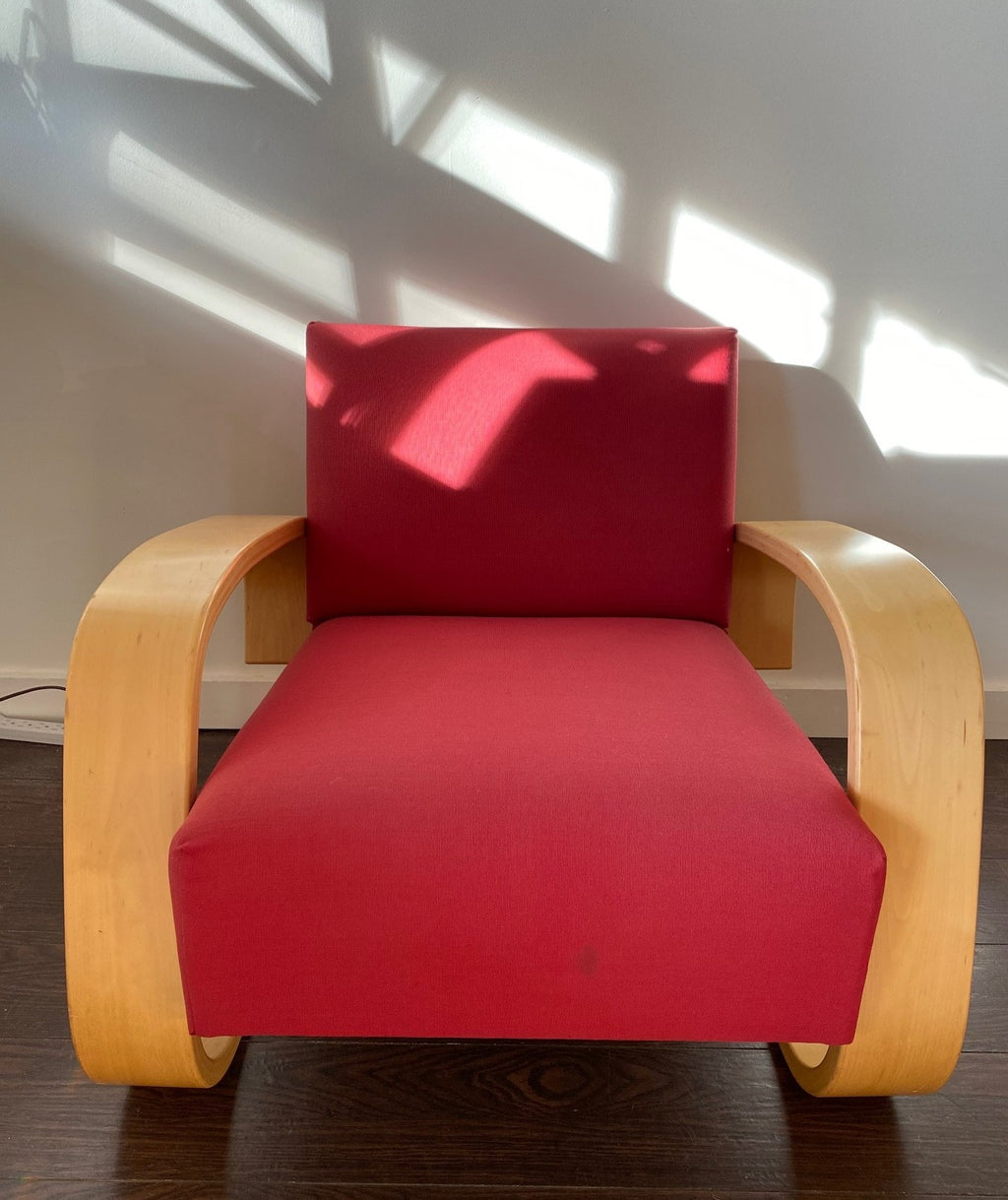 Front View of Fabulous Artek Tank chair in red upholstery. Designed by Finnish designer Alvar Aalto in 1936- Cook Street Vintage