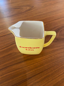 Top of Gordon's Gin bartender's water jug in yellow with gold trim- Cook Street Vintage