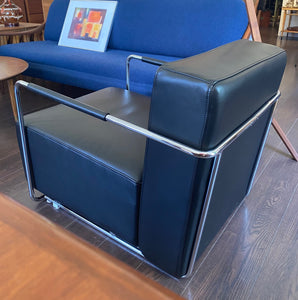 Gorgeous Italian leather reclining chair in the style of Antonio Citerrio. Dark black leather with tubular chrome frame makes this modern chair a must have for any room in your home of office- Cook Street Vintage