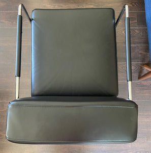 Gorgeous Italian leather reclining chair in the style of Antonio Citerrio. Dark black leather with tubular chrome frame top view- Cook Street Vintage