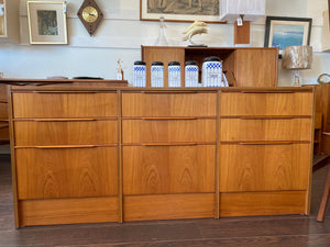 Beautiful smaller MCM teak 9 drawer credenza. Beautiful teak grain front with sculpted teak pulls-Cook Street Vintage