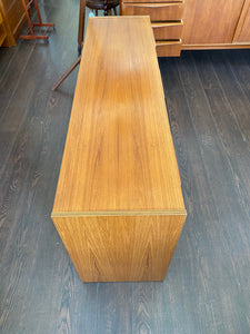 Top view of Beautiful smaller MCM teak 9 drawer credenza teak grain front with sculpted teak pulls-Cook Street Vintage