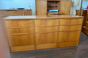 Beautiful smaller MCM teak 9 drawer credenza. Beautiful teak grain front with sculpted teak pulls-Cook Street Vintage