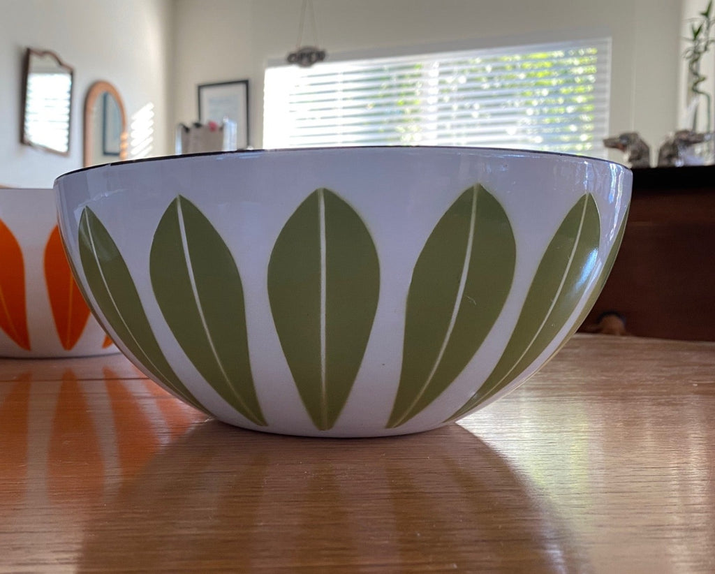 Beautiful enamel Lotus Bowl in green designed in Norway by Grete Prytz Kittelsen for Catherinholm. The gorgeous bowl has some wear on the edge and bottom but is in beautiful vintage condition. Would make a beautiful set with our olive lotus bowl and orange lotus bowl Cook Street Vintage