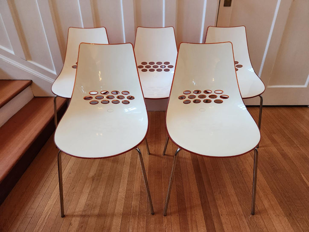 Bright Orange Calligaris "Jam" Chair The seat is made of a two-colour technopolymer shell, with a glossy white seat and an orange transparent back. Metal legs. Made in Italy by Calligaris. Shown with our beautiful oval tulip table.- Cook Street Vintage